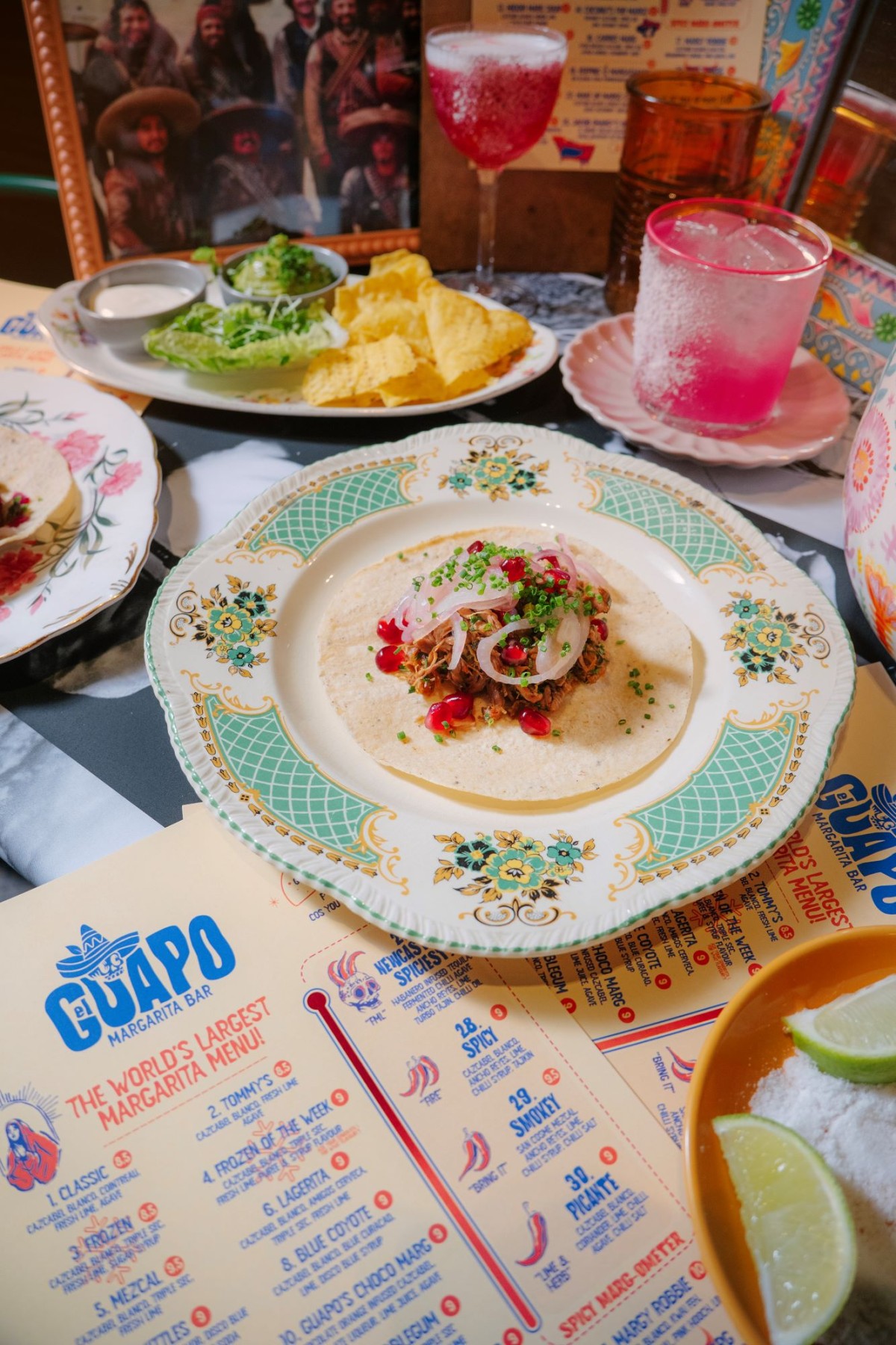 A beautifully arranged table featuring traditional Mexican cuisine and refreshing beverages